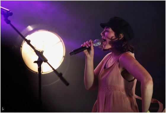 photograph of Remy Beasley singing with Rusty Shackle