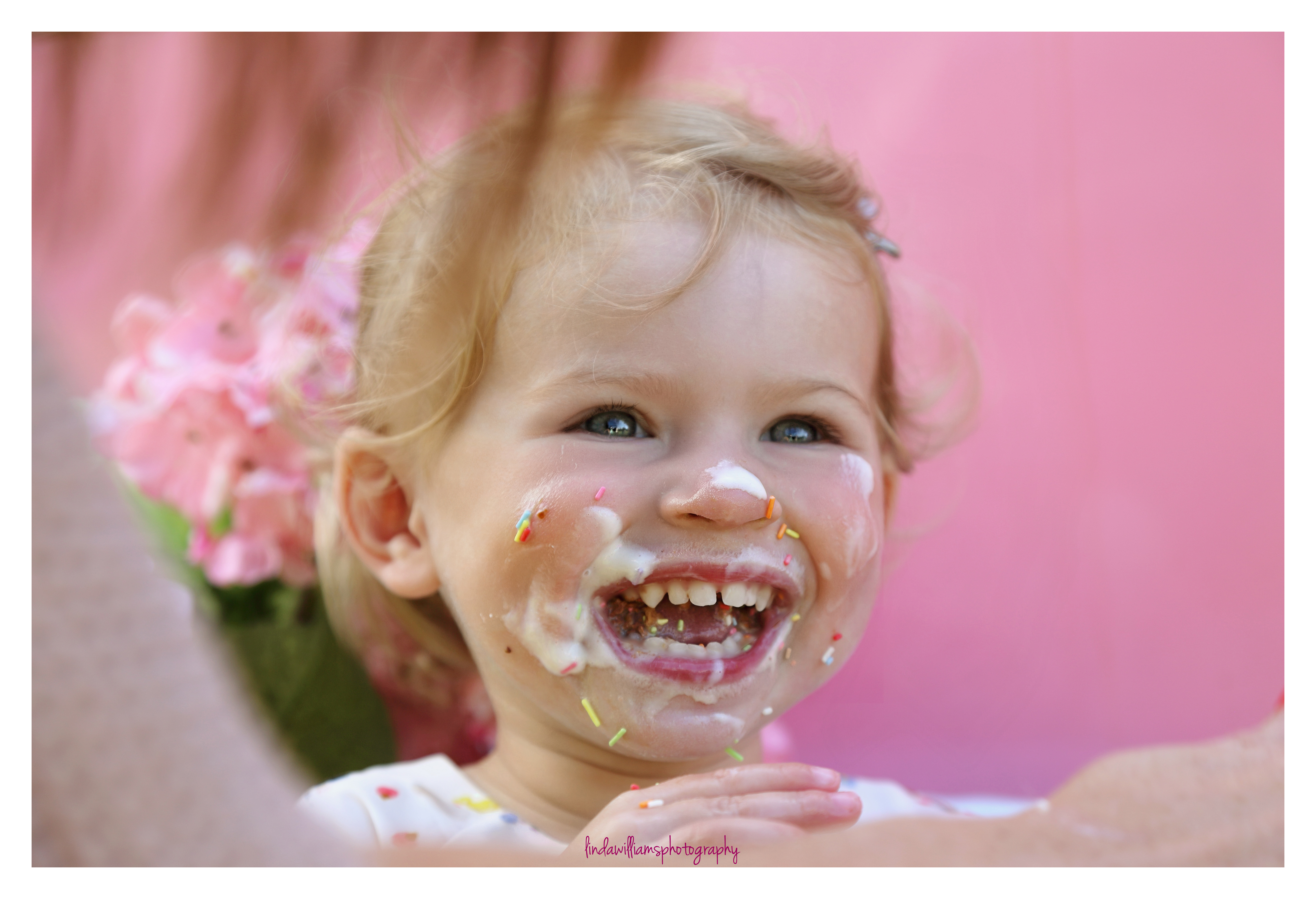 little girl with ice cream on her face