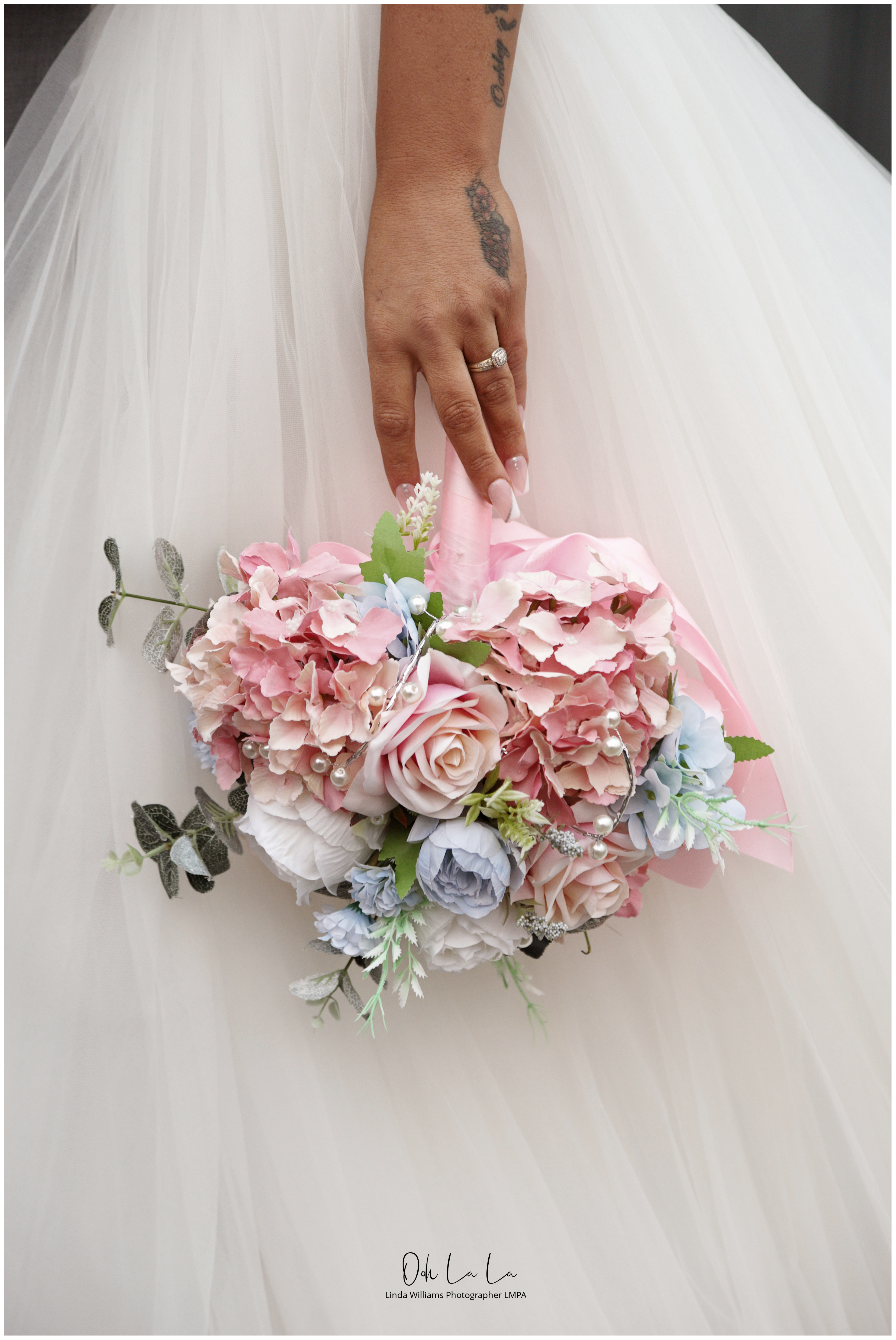 brides bouquet and wedding ring