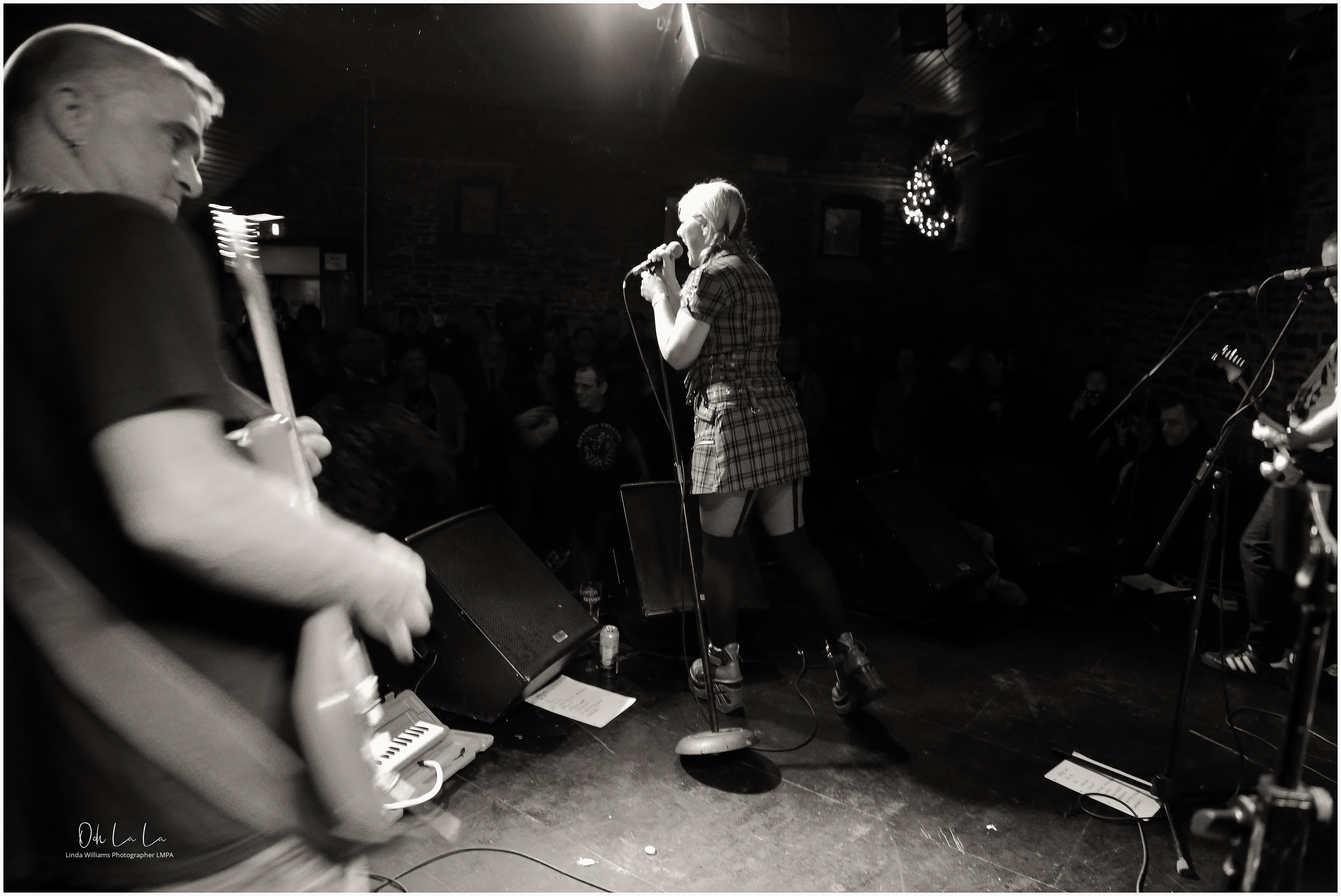 black and white shot of female singer from the stage