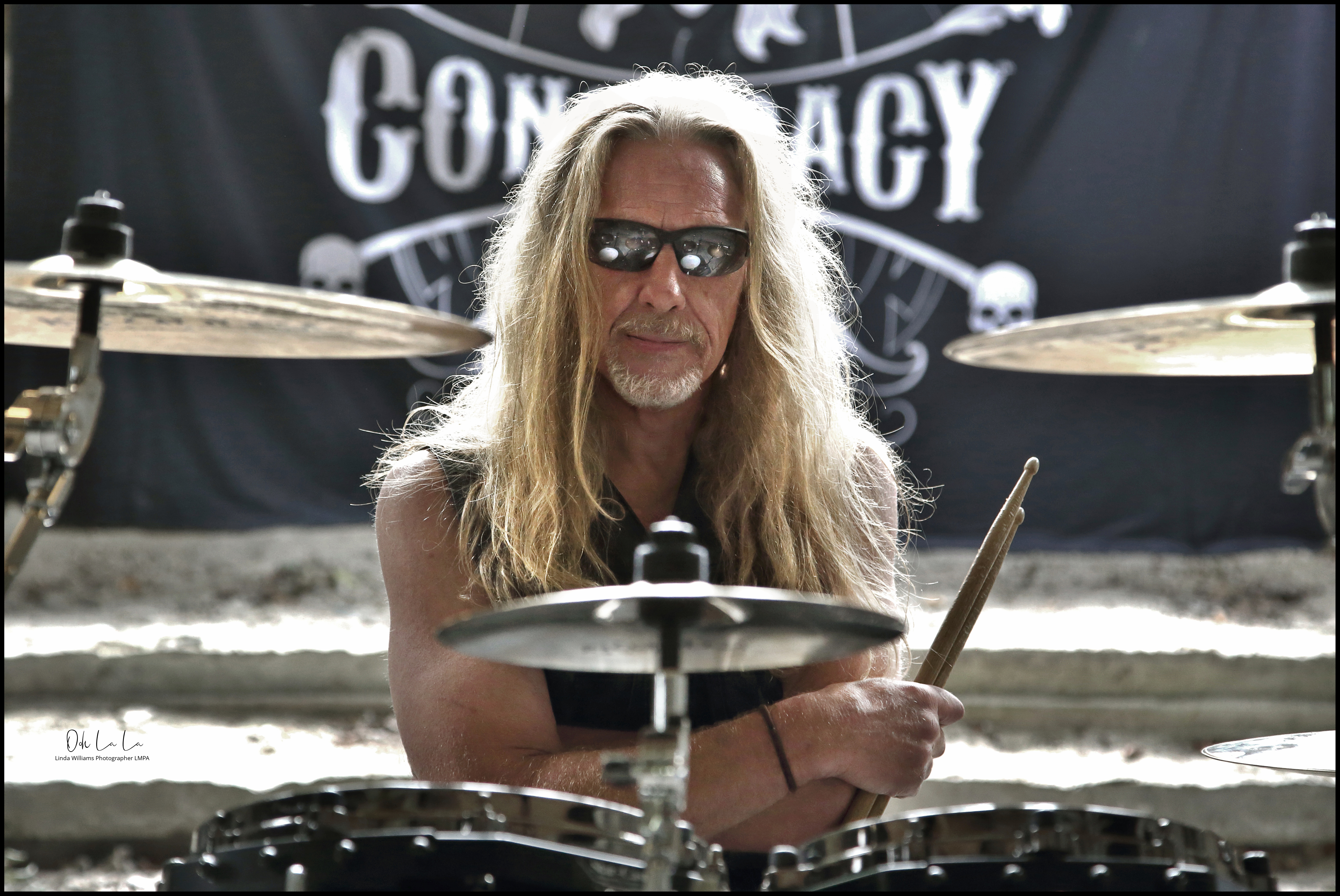 portrait of a drummer kit reflected in sunglasses
