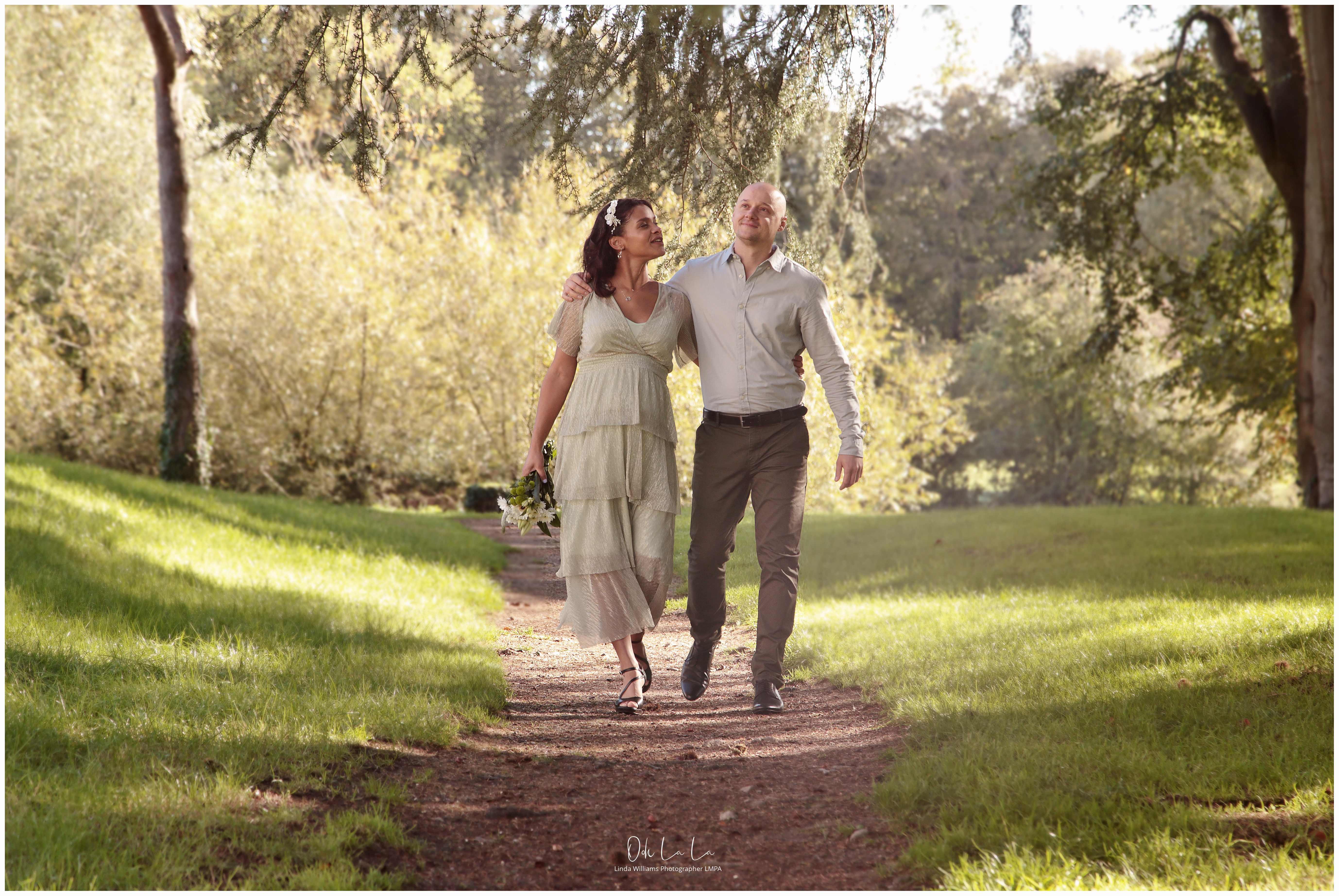 young bride and groom walking at caldicot castle