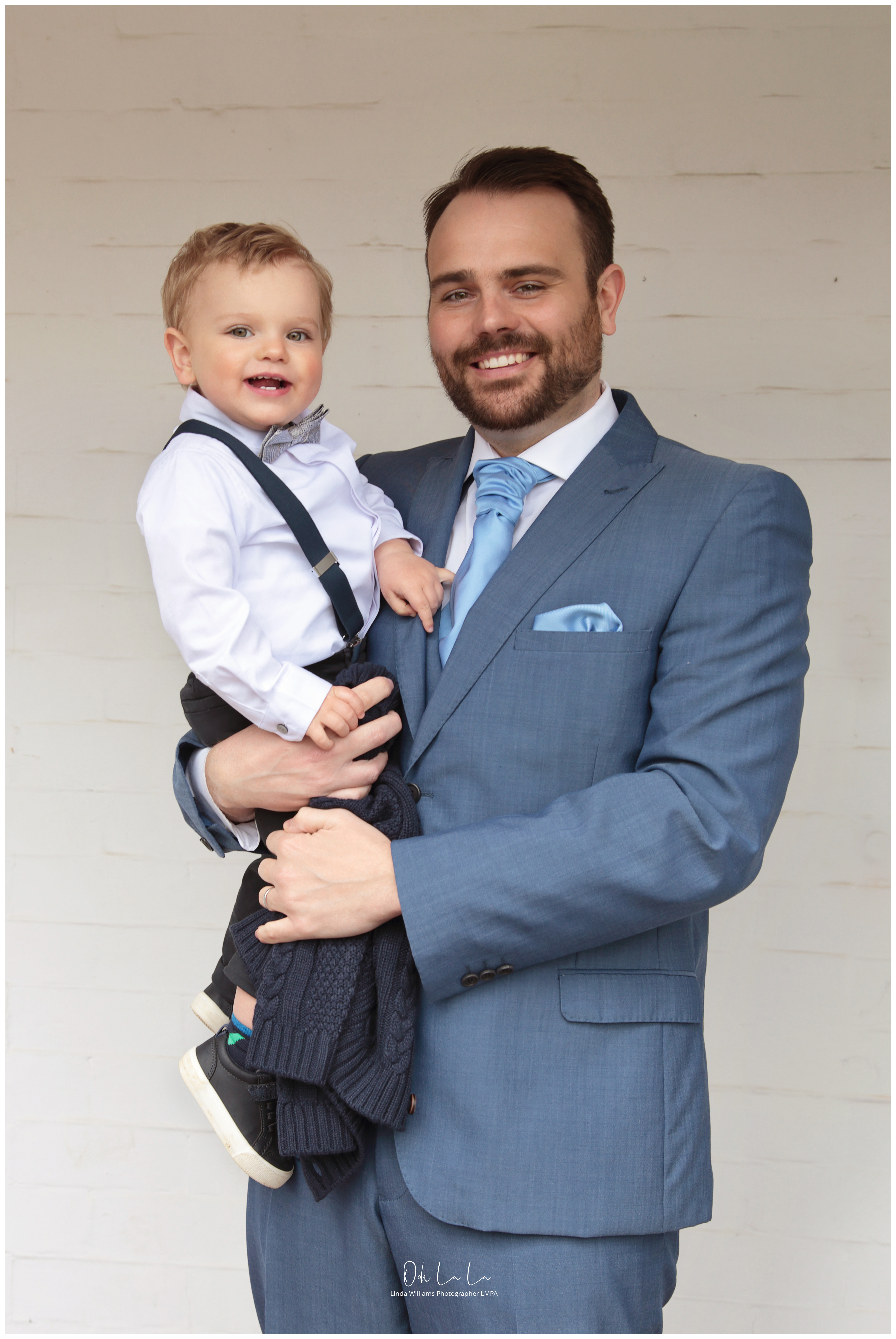 father and son in wedding attire