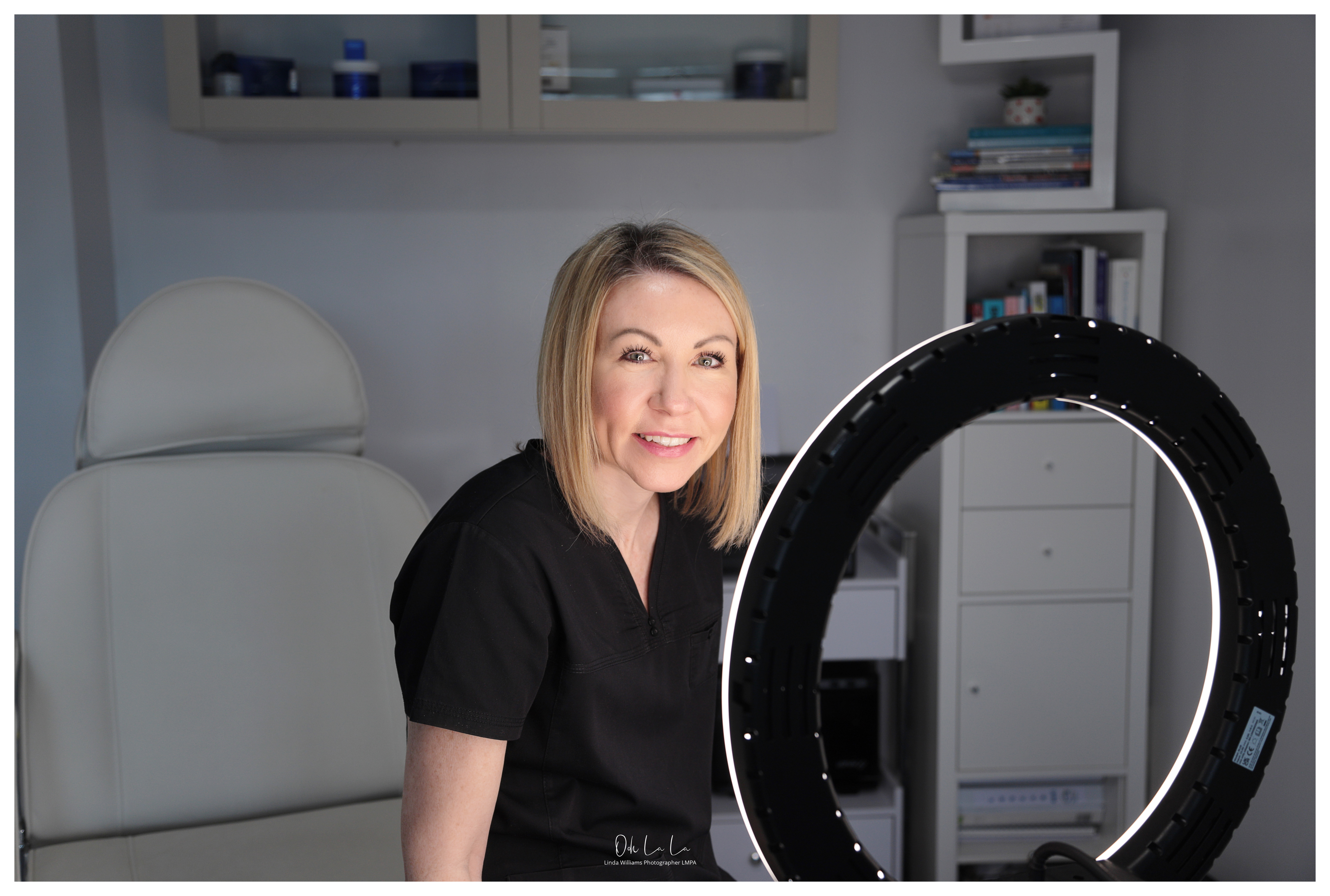 beautician in salon under beauty light