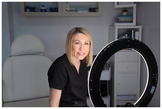 beautician in salon under beauty light