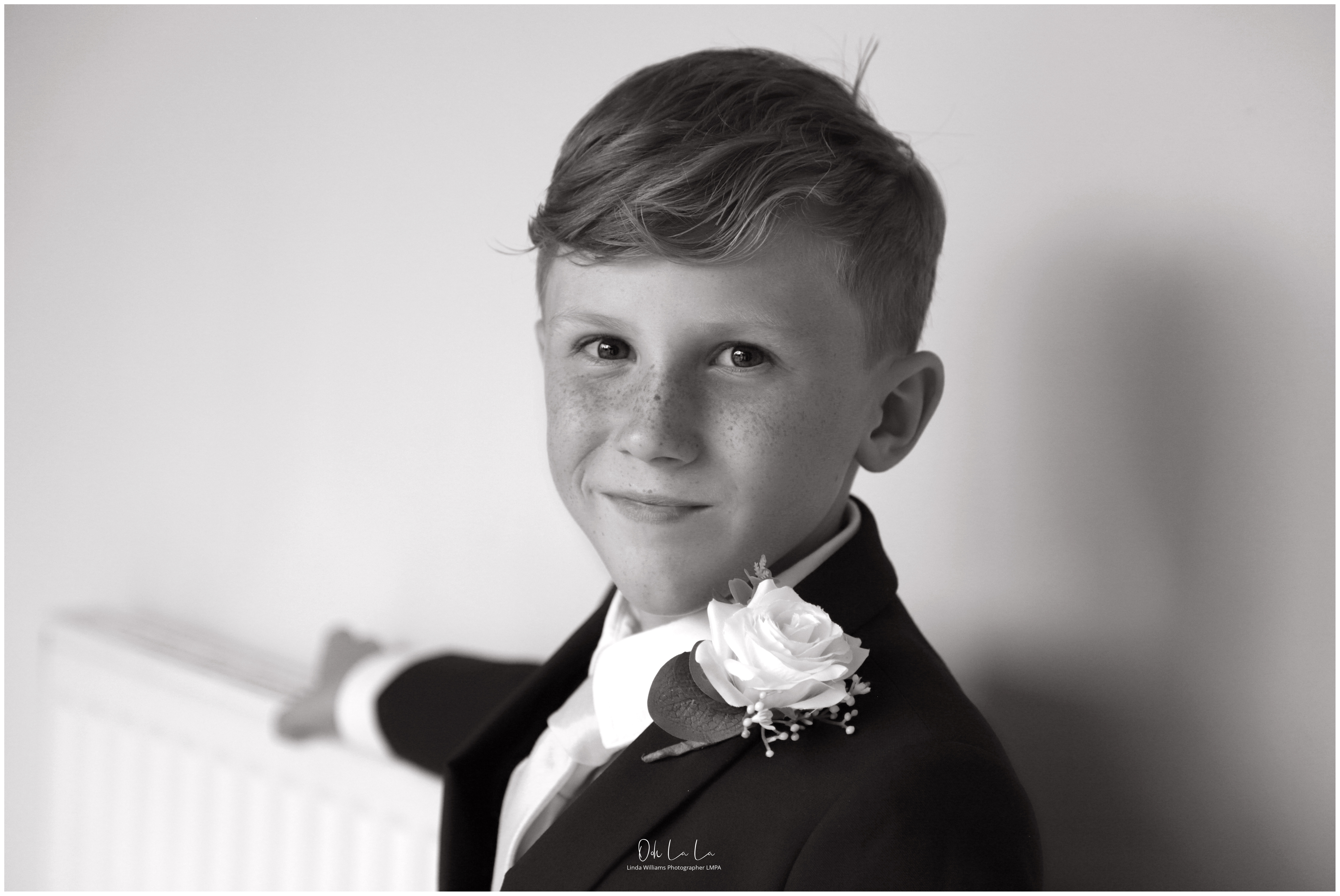 black and white portrait of little boy at wedding