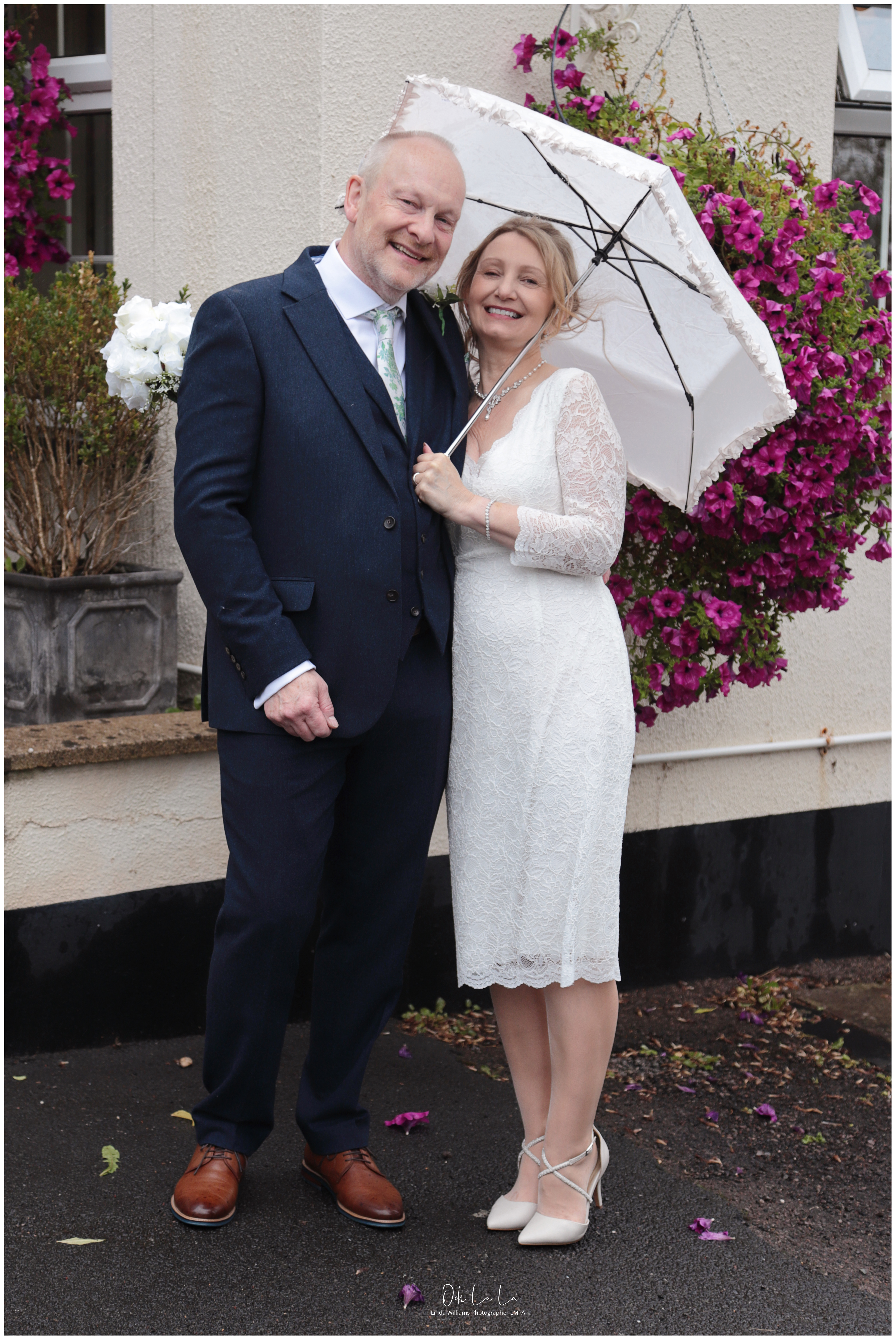 Bride and Groom on a rainy day