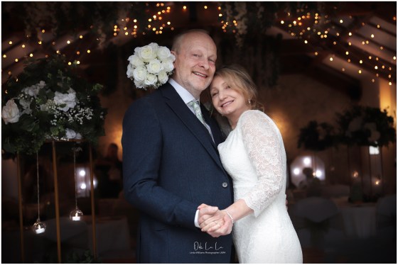 Bride and groom surrounded by pretty lights Woodland Tavern