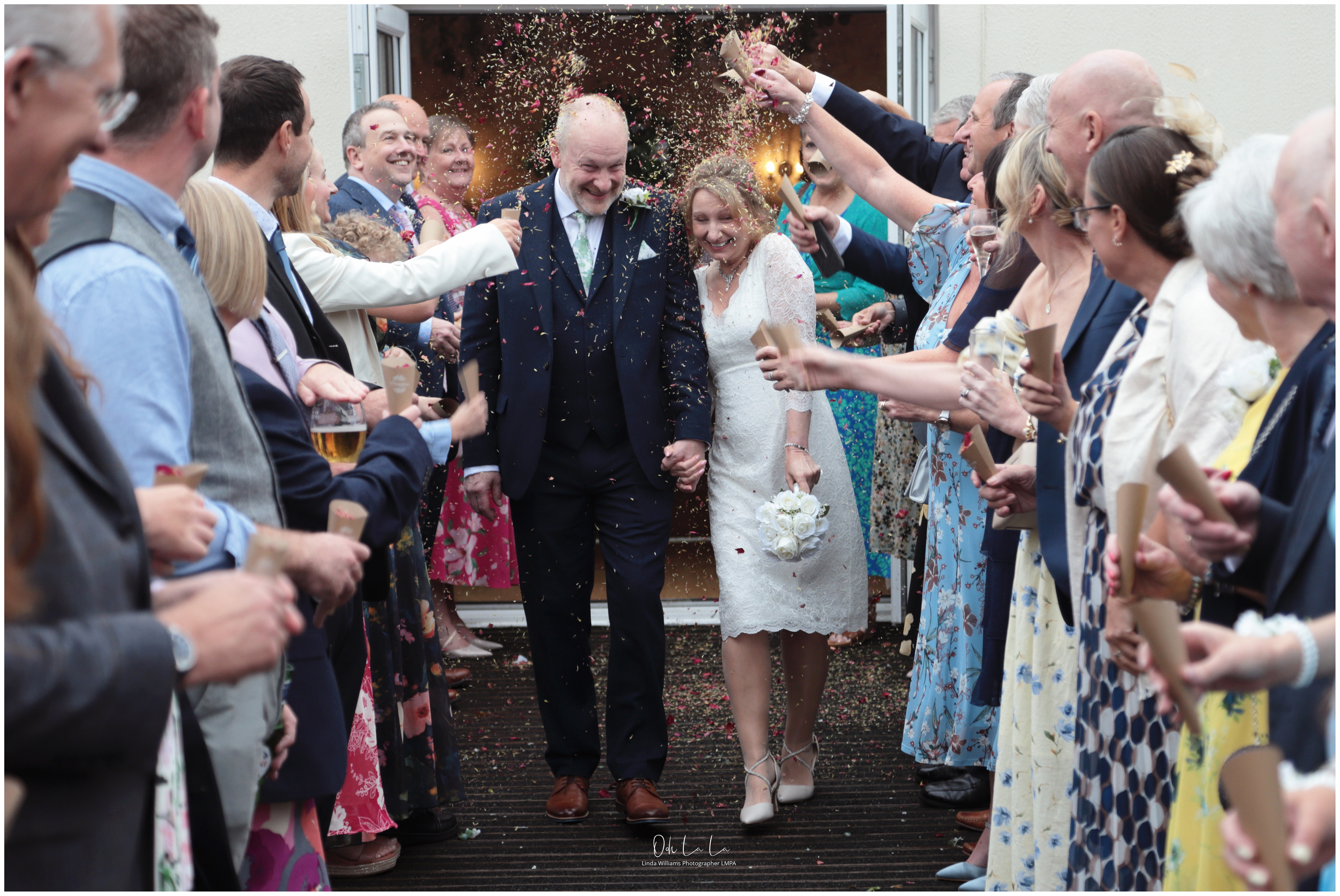 bride and groom in confetti