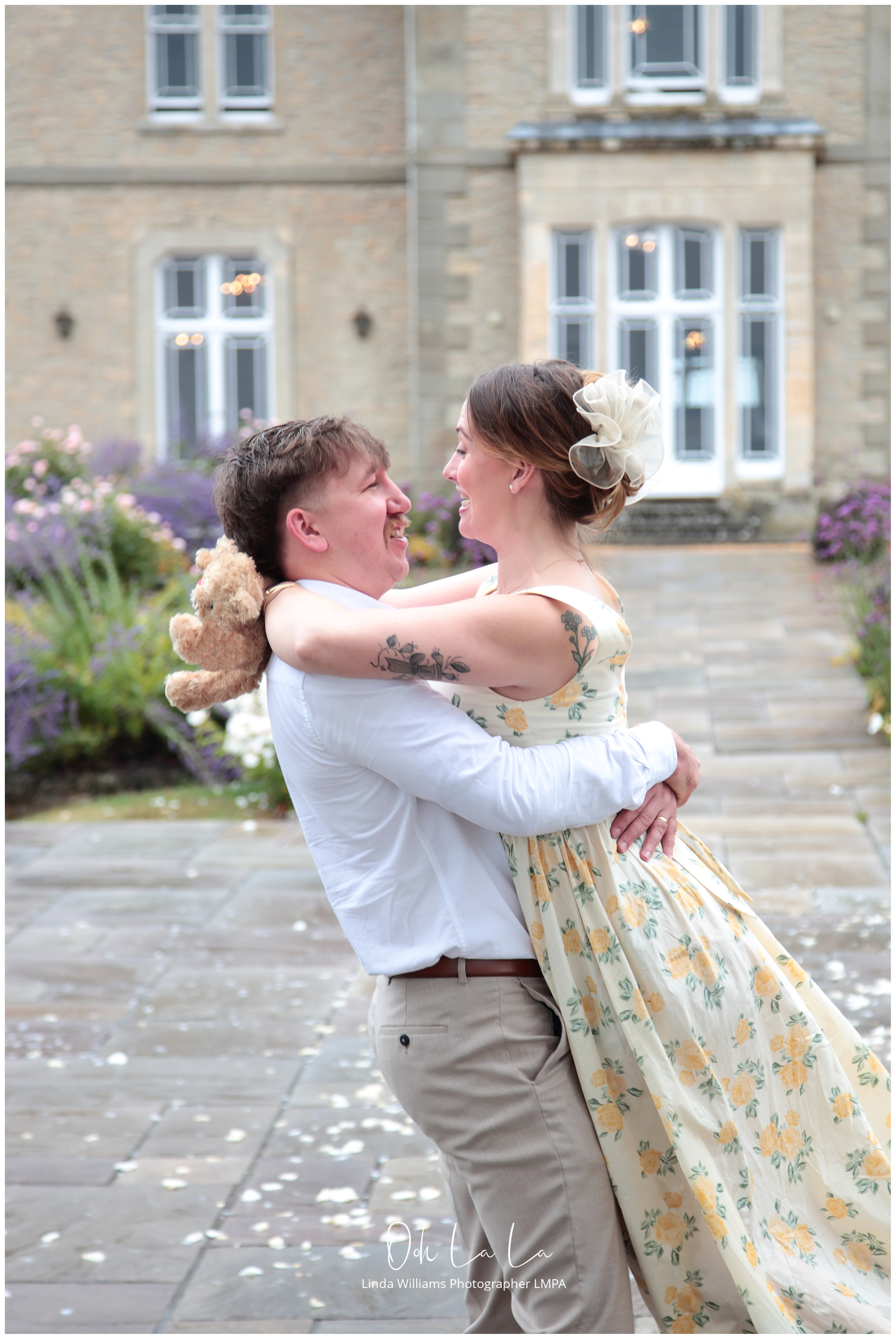 young man swinging his young wife after announcing she is expecting a baby